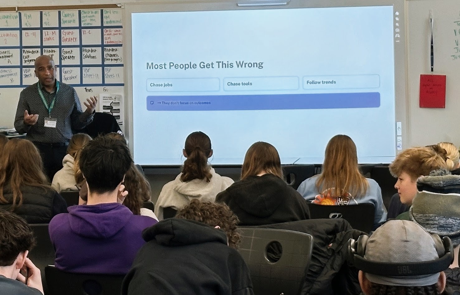 Harrison speaking to an audience